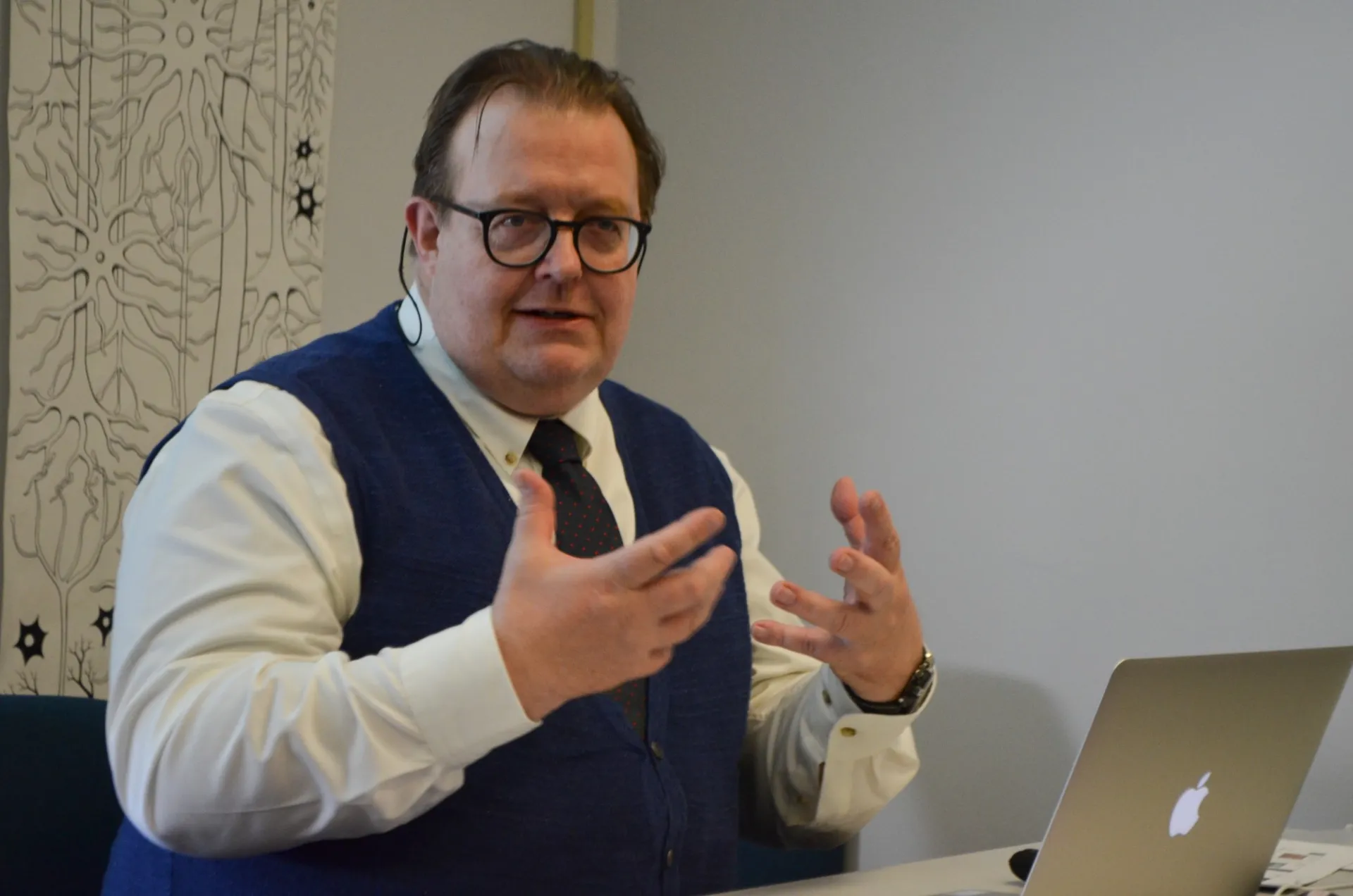 Till-Holger Borchert gestures as he presents his talk